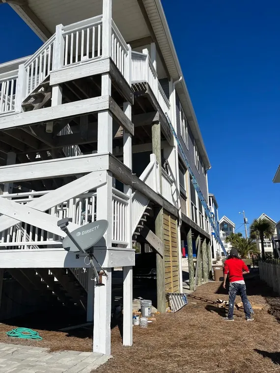 Elevated beach home exterior and stair painting