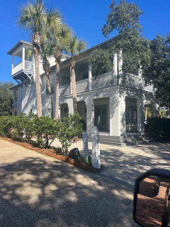 Finished white two-story coastal home exterior